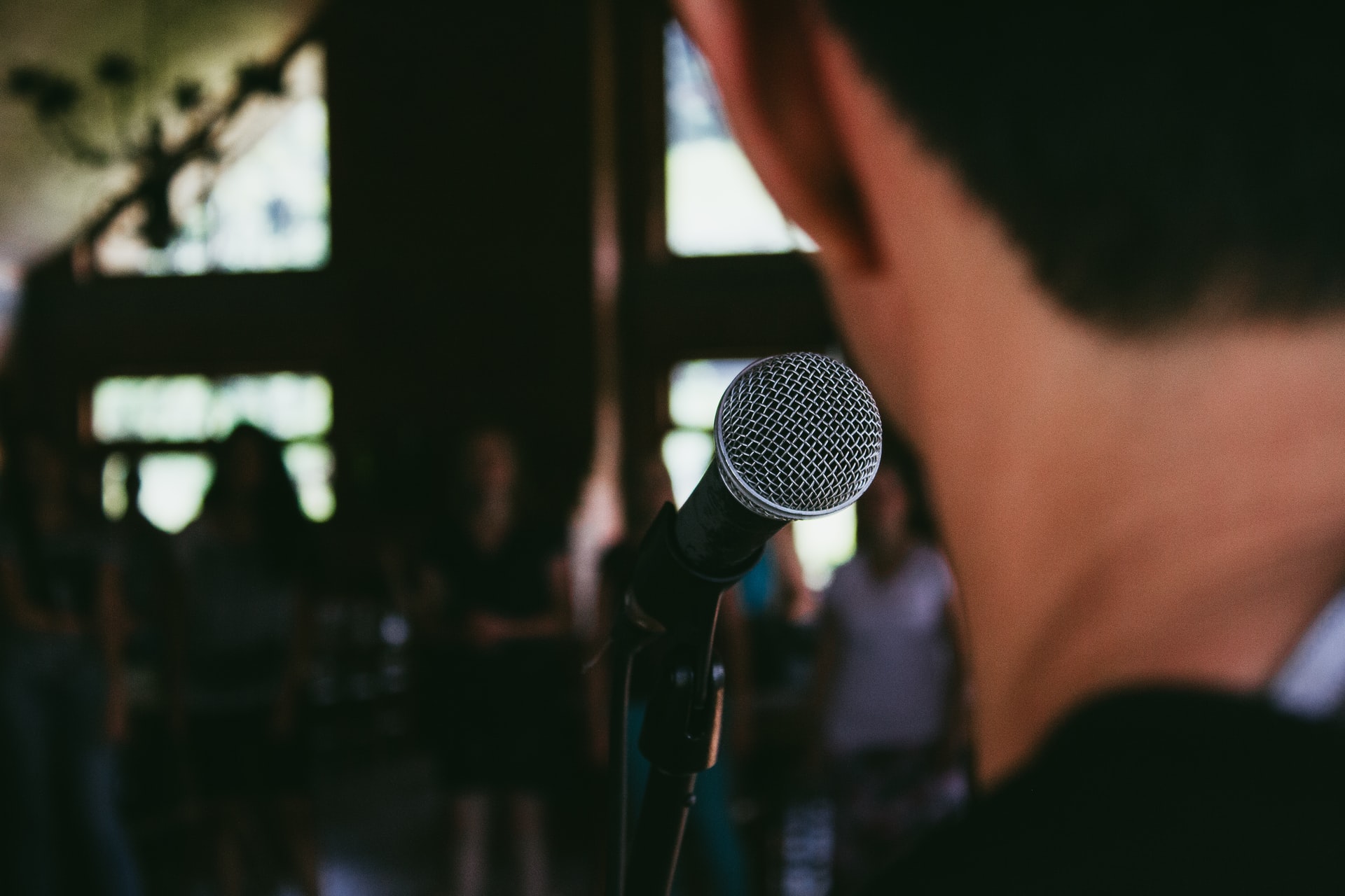 speaking at microphone